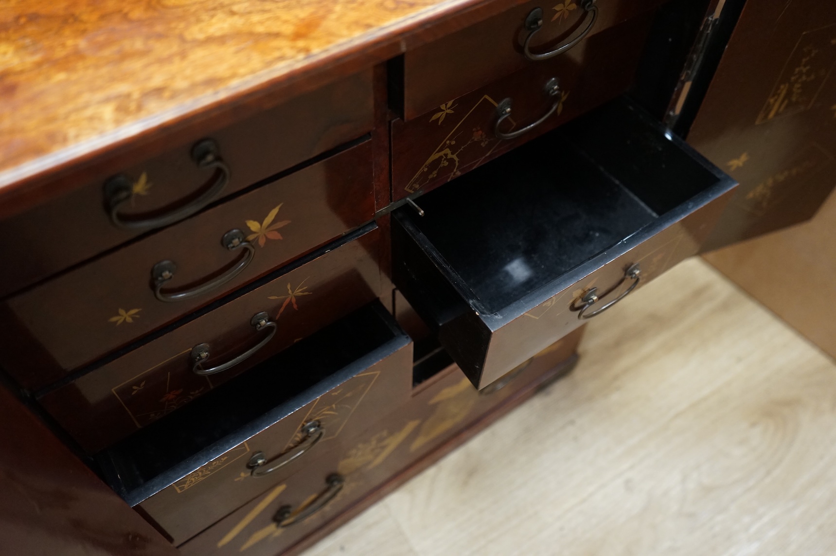 A Japanese lacquered table cabinet and shelves, largest 53.5 x 45cm